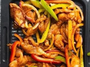 Delicious Air Fryer Chicken Fajitas served on a plate with toppings