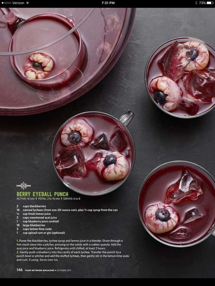 Spooky berry eyeball punch in a glass, perfect for Halloween parties