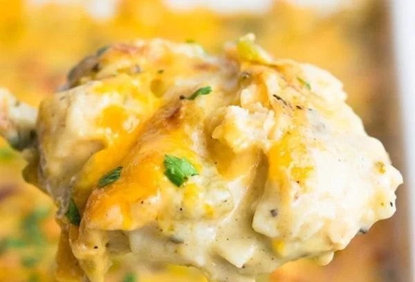 Delicious Chicken Tortilla Casserole baked with layers of chicken, tortillas, and melted cheese