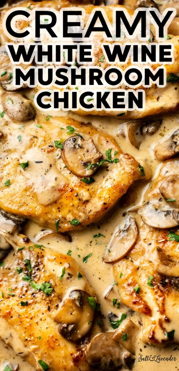 Creamy white wine mushroom chicken served in a skillet with herbs
