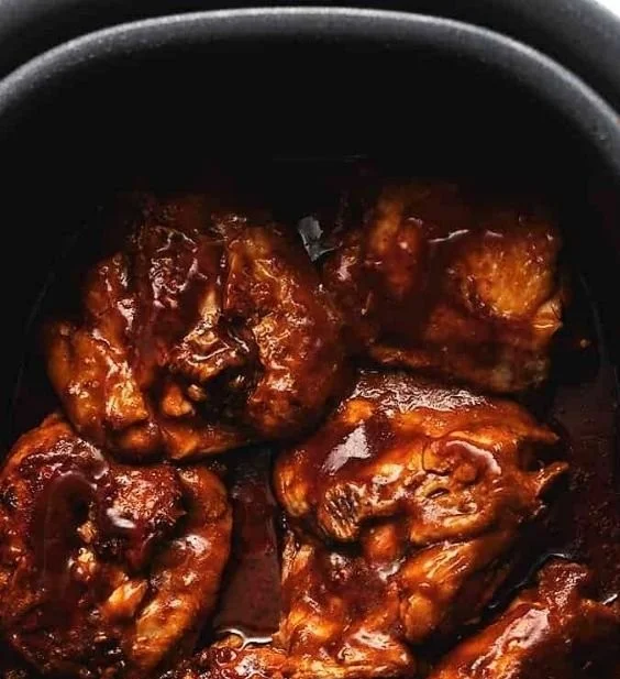 Tender crock pot BBQ chicken thighs ready to serve