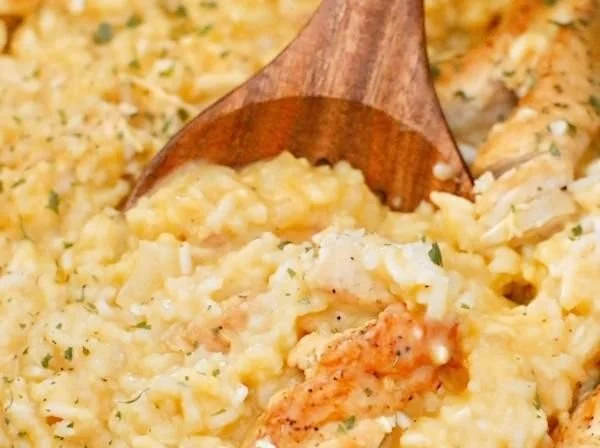 Delicious crock pot chicken and rice served in a bowl with herbs and spices