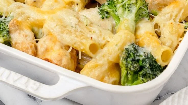 Plate of easy chicken and broccoli pasta dish garnished with parsley