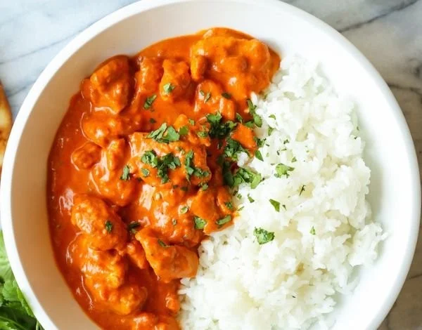 Delicious bowl of easy chicken tikka masala garnished with cilantro
