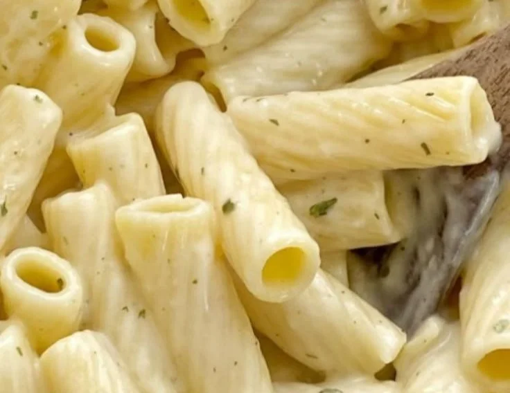 Plate of easy garlic parmesan pasta garnished with parsley