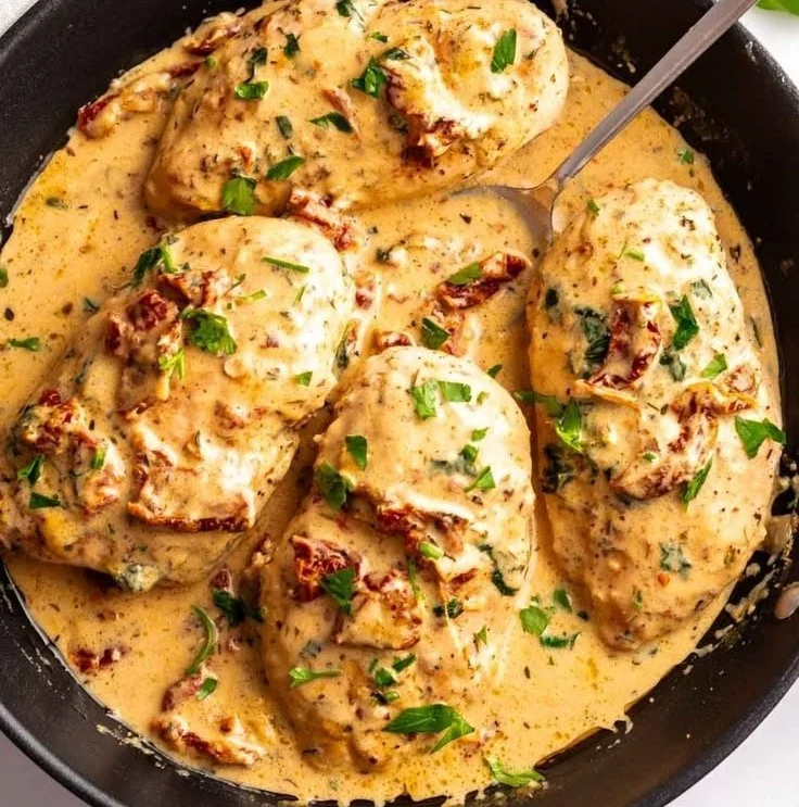 Delicious Marry Me Chicken dish served on a plate with herbs and creamy sauce