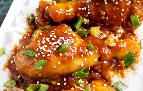 Delicious honey garlic chicken cooked in a crockpot, served on a plate.