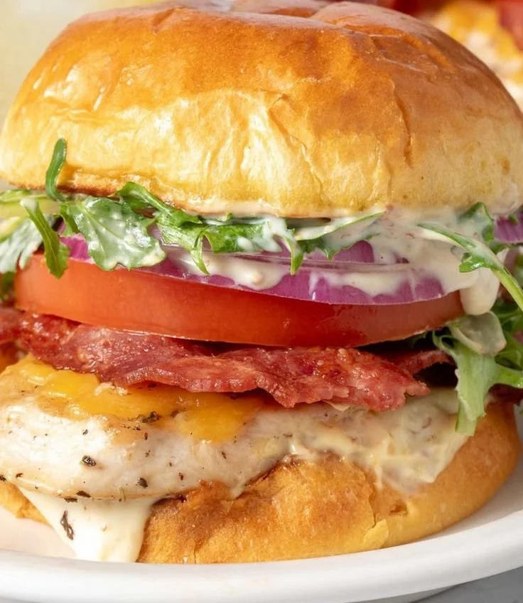 Delicious grilled chicken sandwich with fresh ingredients and toppings