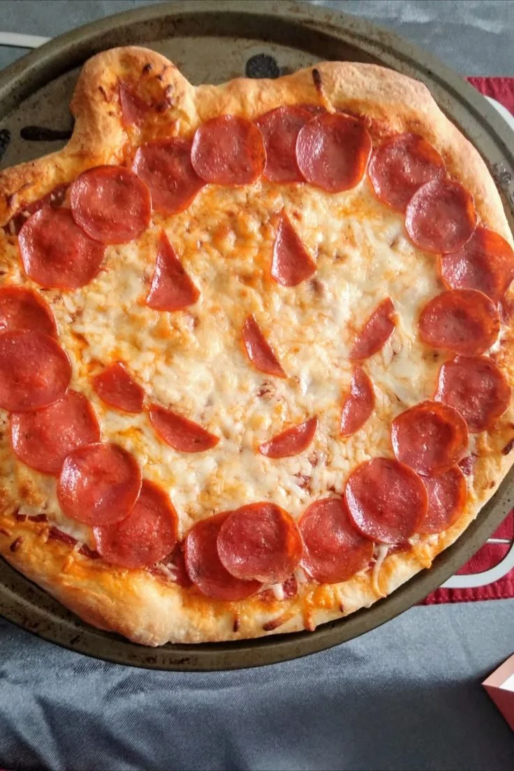 Spooky Halloween Pizza decorated with festive toppings for a Halloween celebration.
