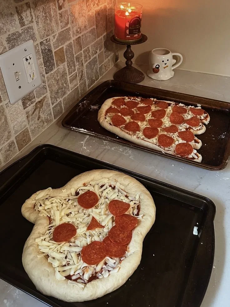 Festive Halloween pizza decorated with spooky toppings and seasonal colors.