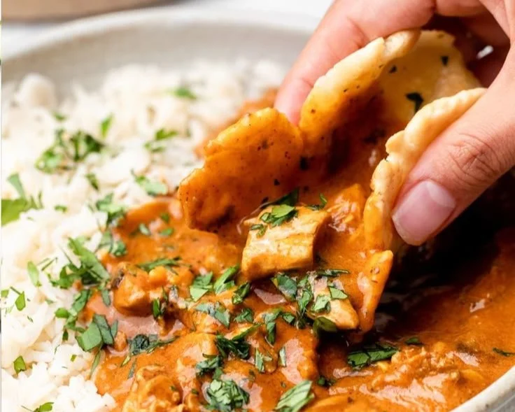 Healthy Chicken Tikka Masala served in a bowl with fresh herbs