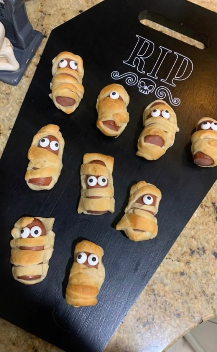 Delicious mummy pigs in a blanket appetizer for Halloween parties