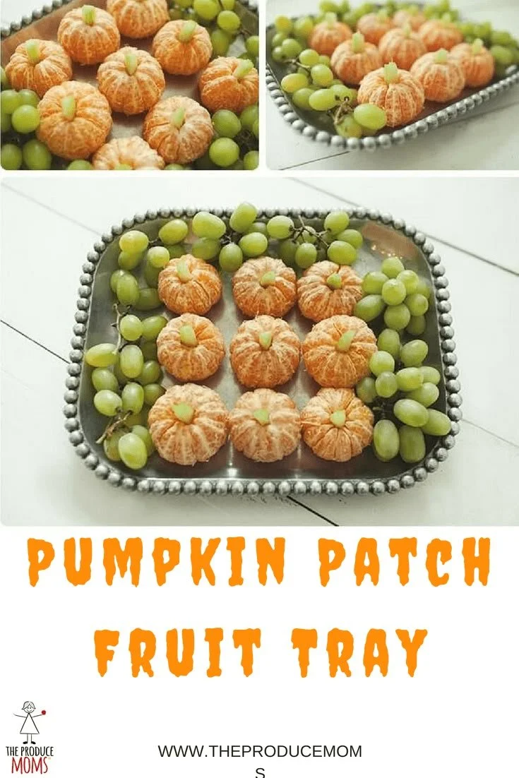 Colorful pumpkin fruit tray filled with seasonal fruits for Halloween celebration.