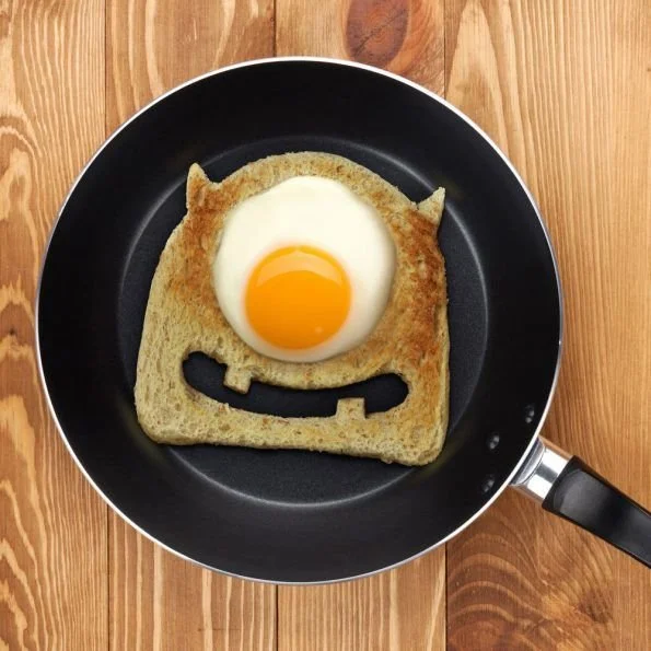 Colorful monster breakfast for kids with fruits, pancakes, and fun decorations